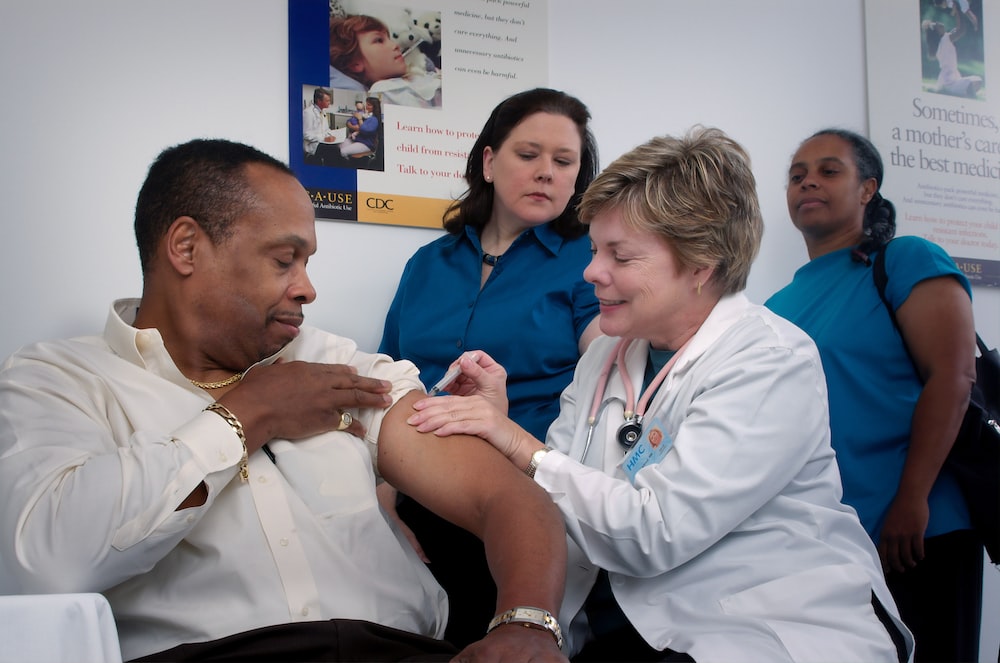 A focused nurse attentively checking a patient's medical chart, exemplifying the dedication and care that nursing professionals provide every day.